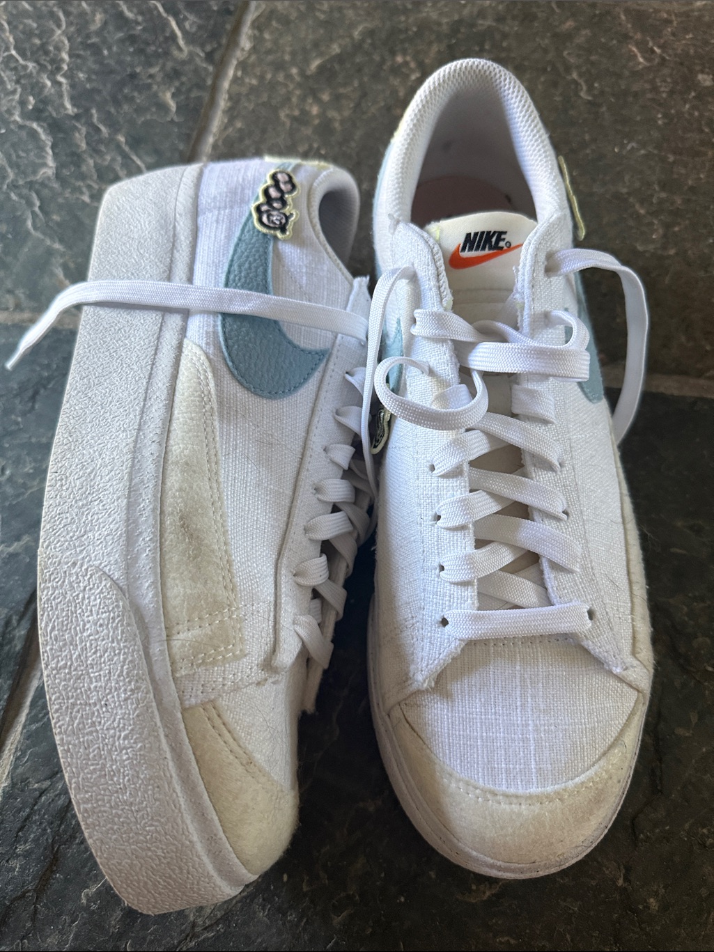 Nike White Low-Top Sneakers With Pale Blue Swoosh And Orange Logo Tab